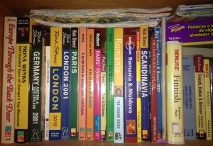 Just one of our many shelves of travel guidebooks!