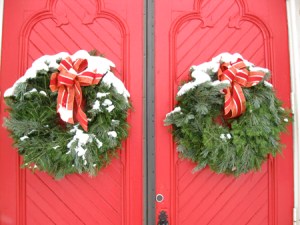 Beautiful Christmas wreaths decorating a church's doors.